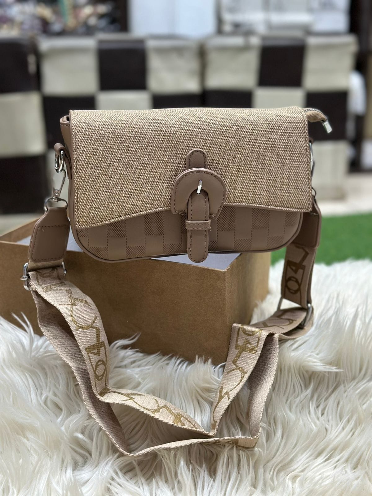 Elegant coffee color women’s crossbody shoulder bag with textured fabric and buckle closure