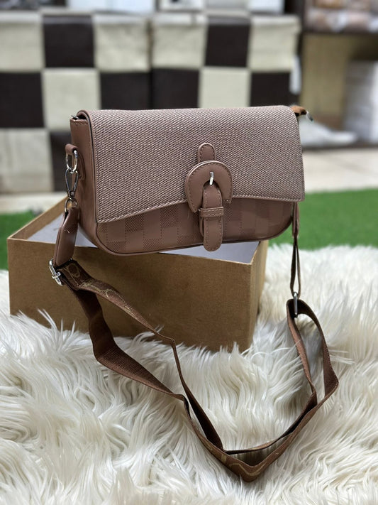 Elegant brown women’s crossbody shoulder bag with textured fabric and buckle closure
